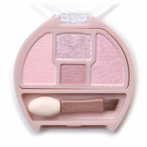 Compact eye shadow palette with 4 pink-toned shades and attached brush applicator