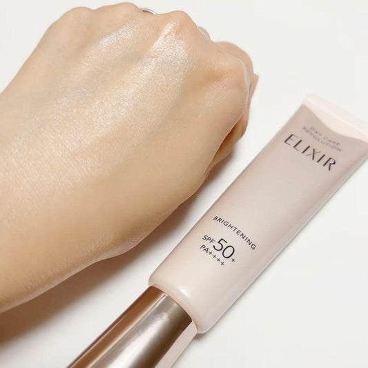 UV emulsion on skin with cream-pink tube, SPF50+ visible on label.
