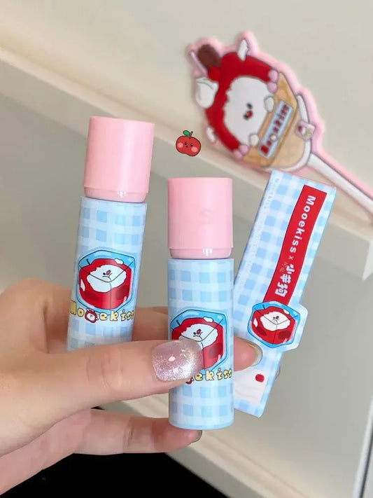 Lip mud set in hand: blue bottle, pink cap, and lip mud tube packaging