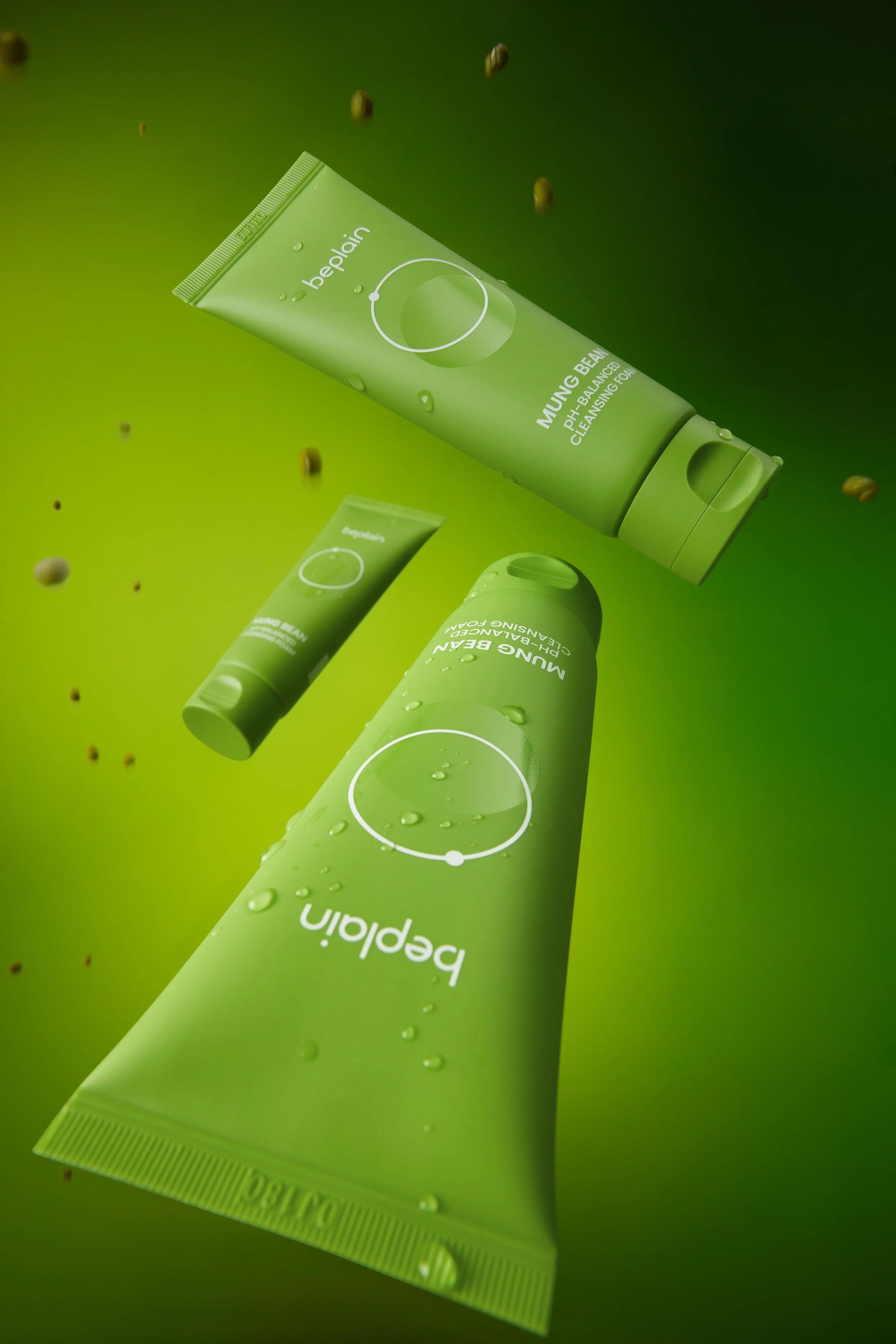 Green beplain cleansing foam tube with smaller tube and sachet pieces nearby