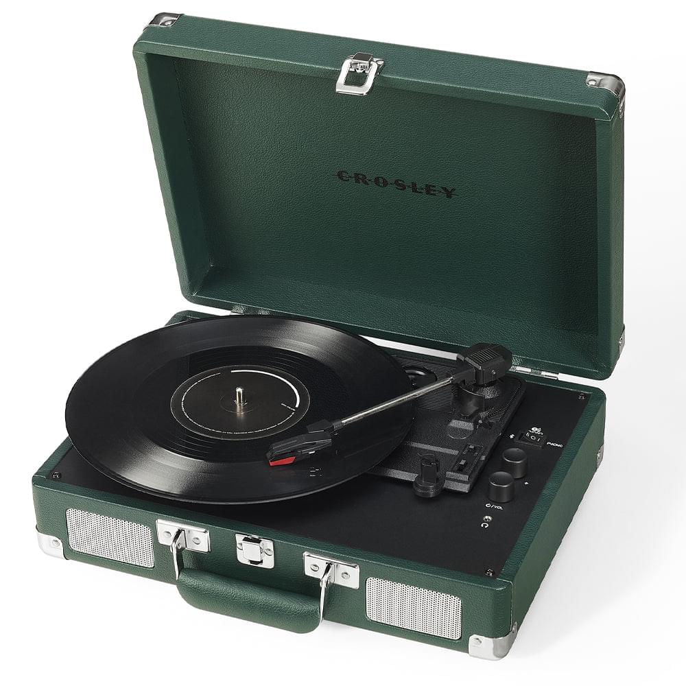 Emerald green portable turntable in open hard case, with vinyl record and controls