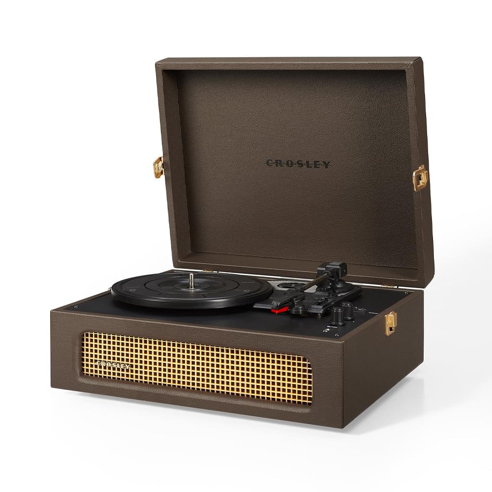 Dark portable turntable in open case with speaker grille and platter on base