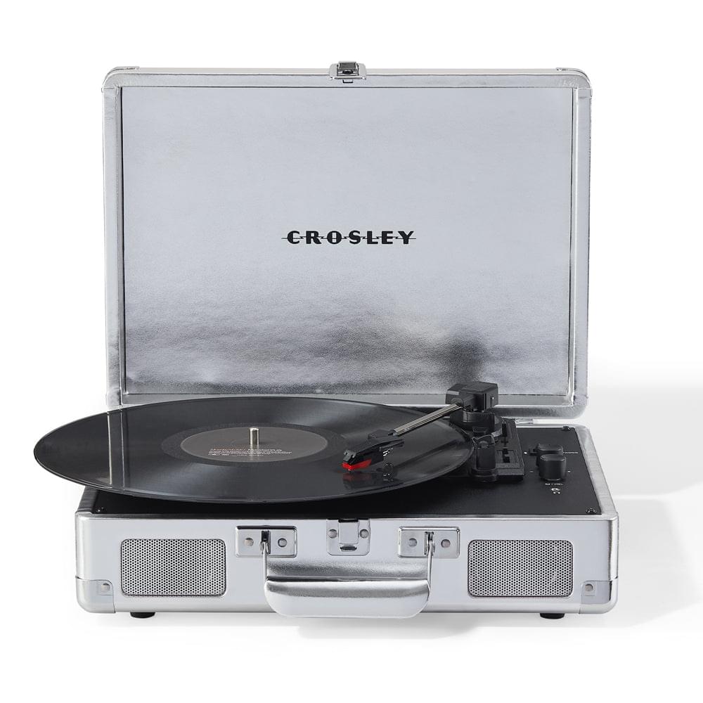 Silver turntable in open hard case, black vinyl record on platter