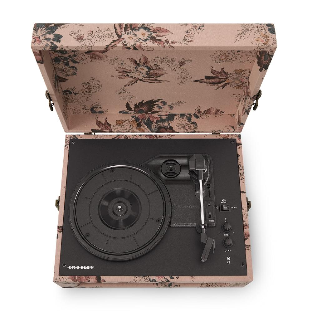 Floral portable turntable with open lid, black record player controls visible