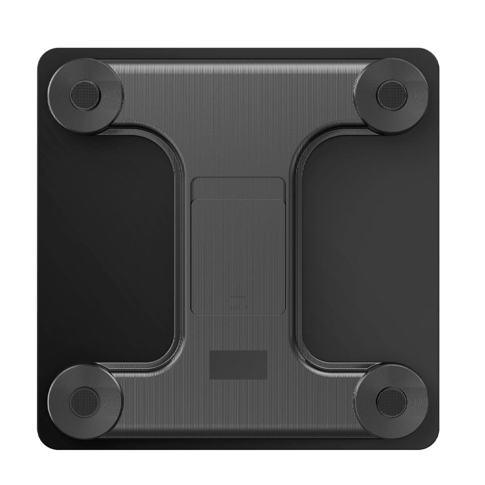 Front view of dark body scale with four round sensor pads and textured surface