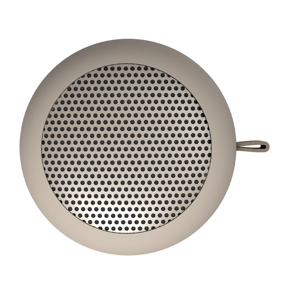 Ivory sand Bluetooth speaker top view with circular mesh and side strap