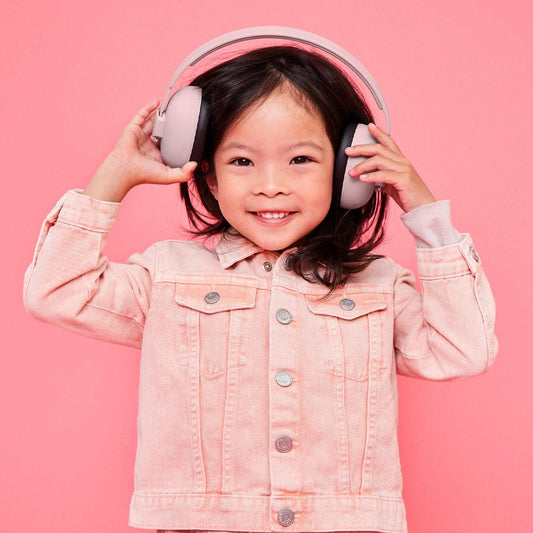 Dusty rose kids ear muffs worn by a child with pink jacket