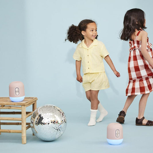 Cloudy blue kids Bluetooth speakers with light, glowing bases and top button