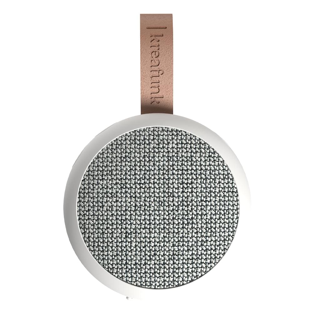 White Bluetooth speaker with gray fabric grille and brown leather strap loop