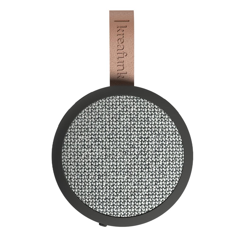 Black Bluetooth speaker with textured fabric grille and brown leather wrist strap