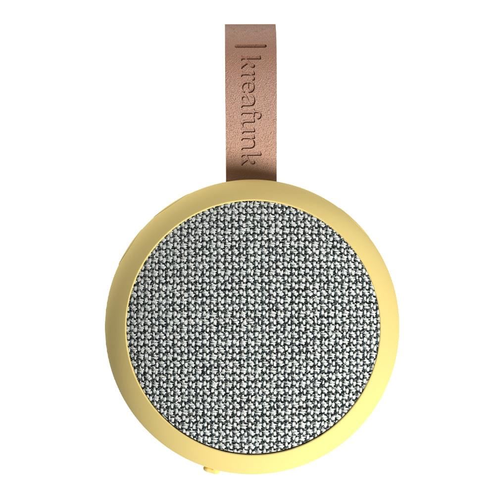 Soft yellow Bluetooth fabric speaker with gray woven grille and tan strap handle