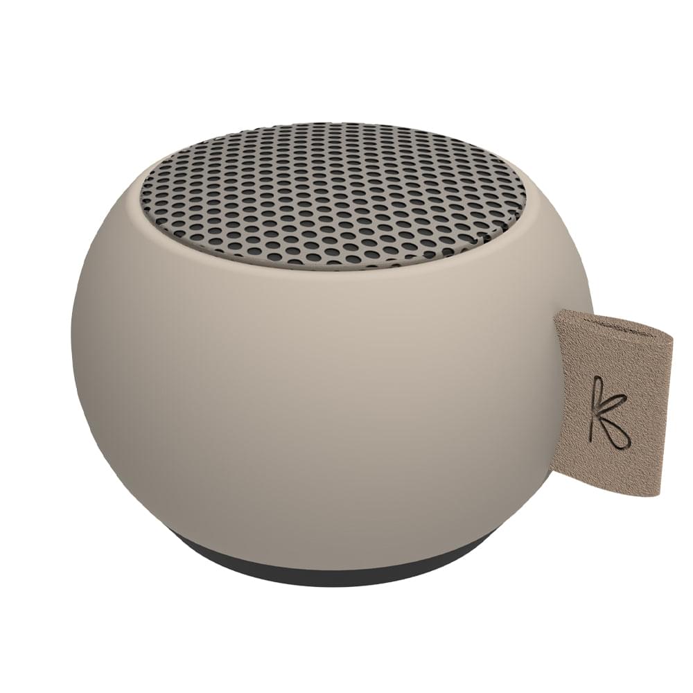 Ivory mini Bluetooth speaker with circular grille top and side carry strap