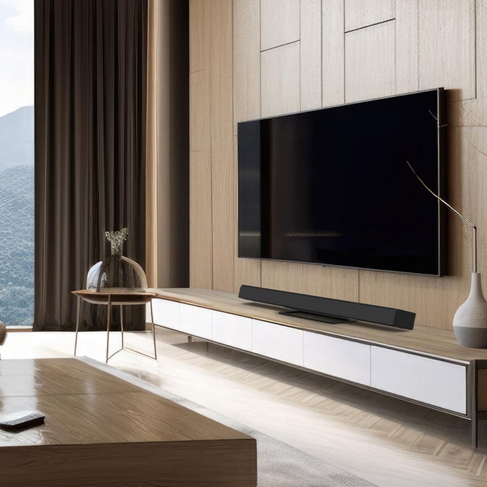 Kanto S10 center speaker stand under a wall-mounted TV in living room