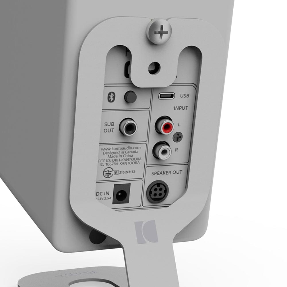 Gray rear connection panel on a desktop stand with USB and audio ports