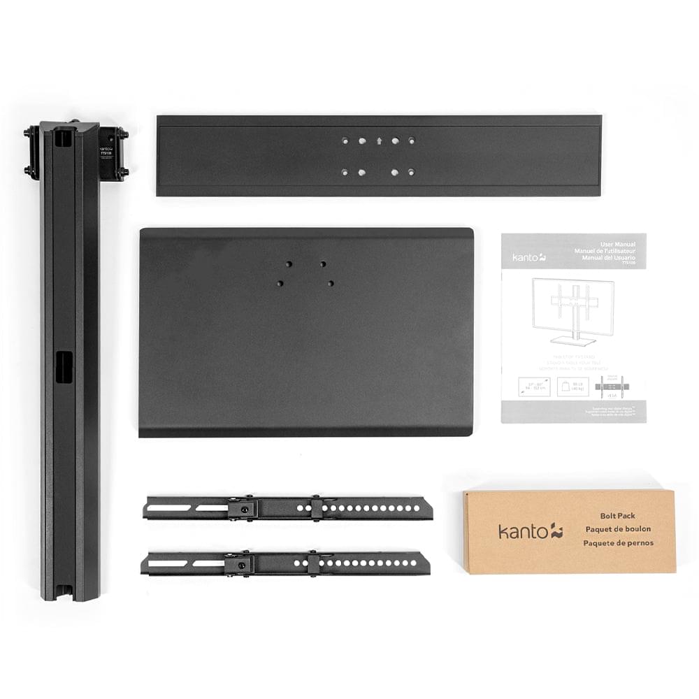 Black TV stand components laid out: mounting frame, rails, and hardware pack