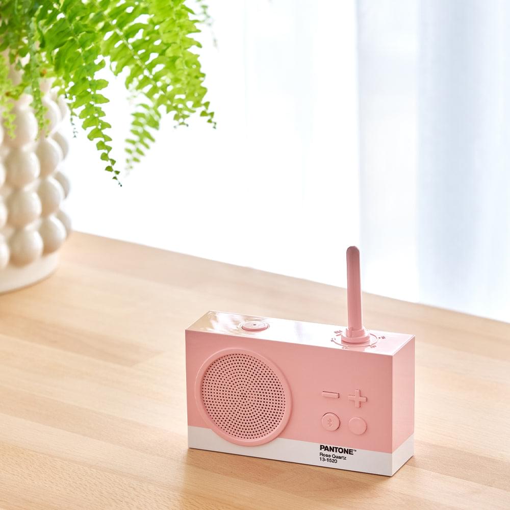 Rose pink FM radio Bluetooth speaker with antenna, front grille and PANTONE branding