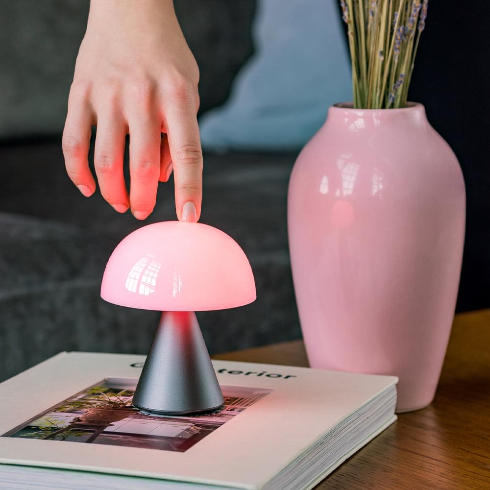 Portable LED lamp with pink dome shade on a gunmetal base