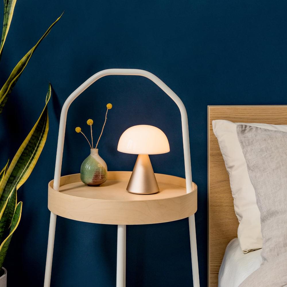 Portable LED lamp with white dome shade and arched handle stand