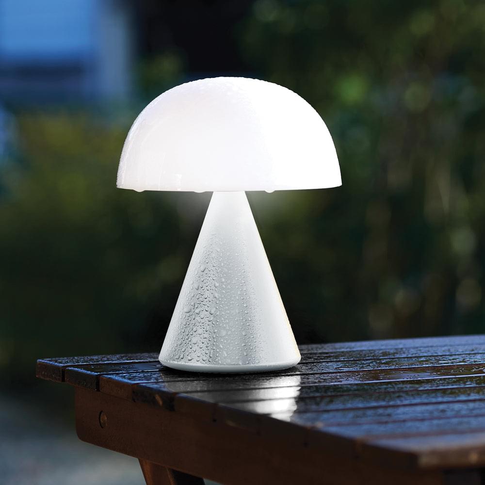 White portable LED lamp with raindrops on the base and rounded dome shade