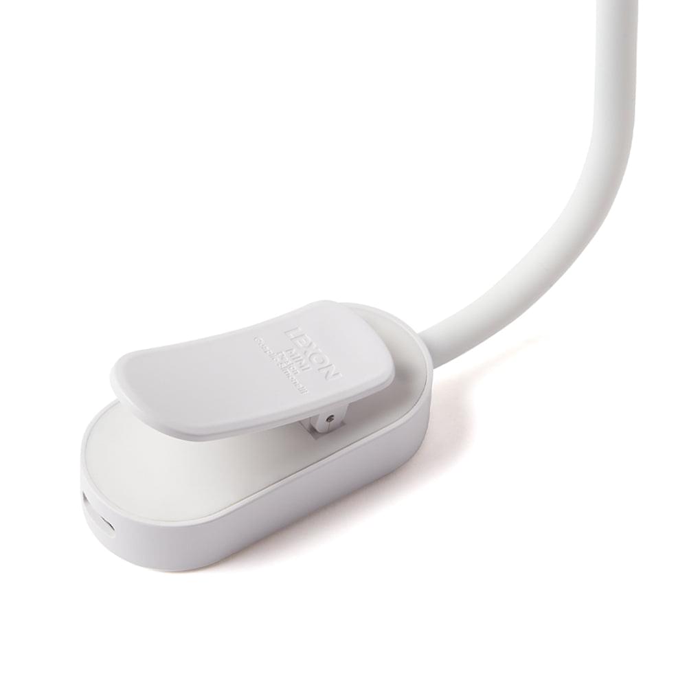 Flexible LED lamp controller base with cable, smooth white housing and button