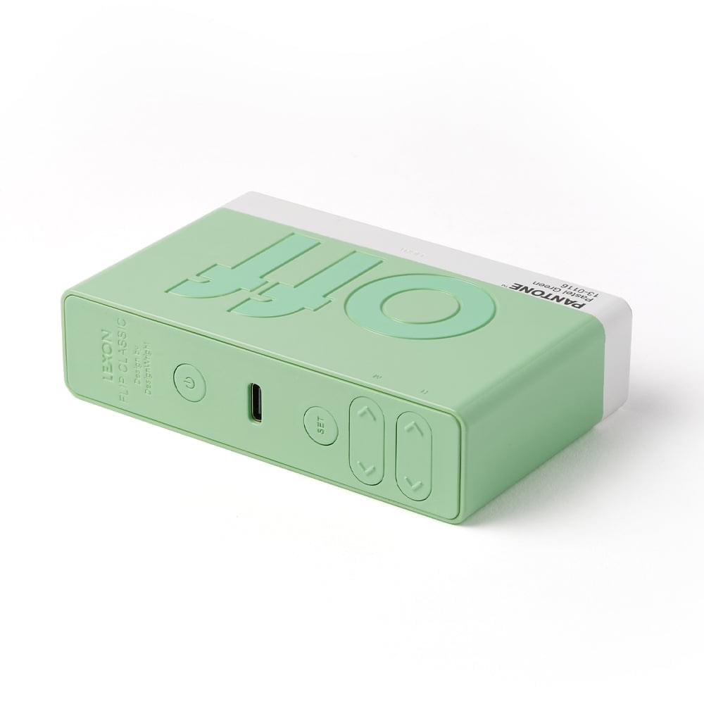 Green reversible alarm clock side with buttons and charging port