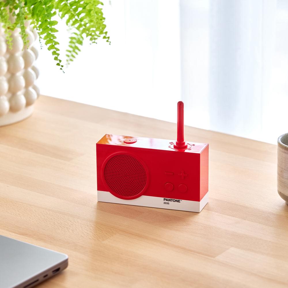 Red PANTONE 2035 FM radio and Bluetooth speaker with top antenna and -/+ controls