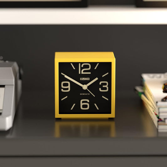 Newgate Cube mantel clock in citrus yellow with black face and gold Arabic numerals