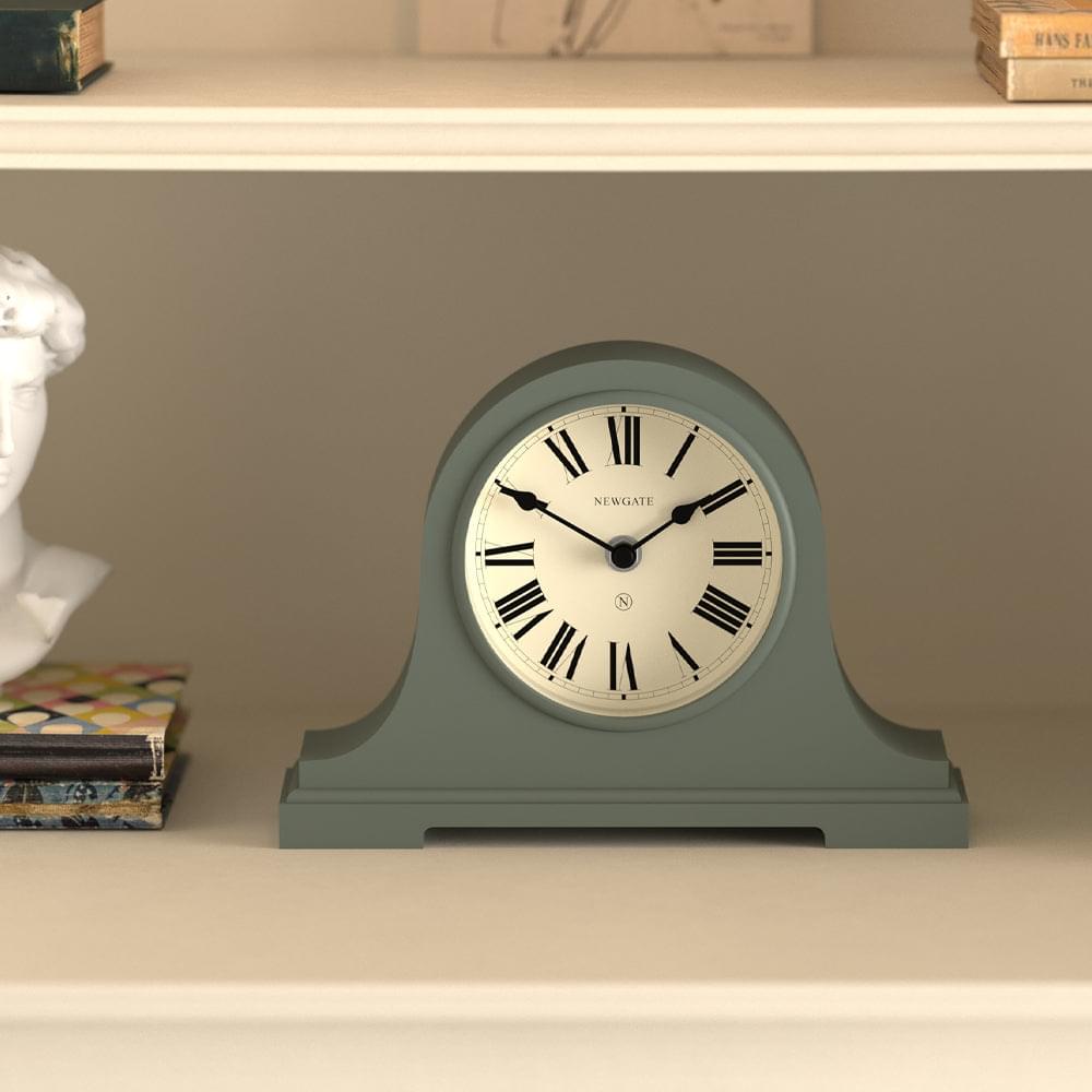 Asparagus green mantel clock with rounded arched case and white dial, black Roman numerals