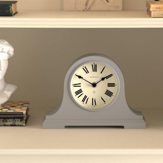Grey mantel clock angled view, white dial with Roman numerals and black hands