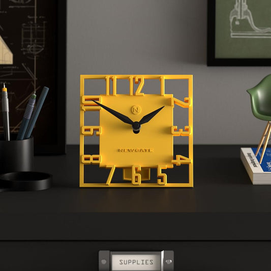 Yellow square mantel clock with black hands showing 12 and 6, NEWGATE logo