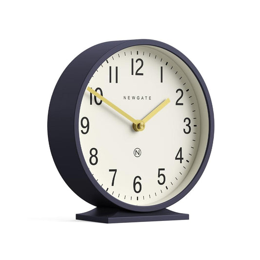 Petrol blue mantel clock with cream dial, gold hands, and curved navy stand