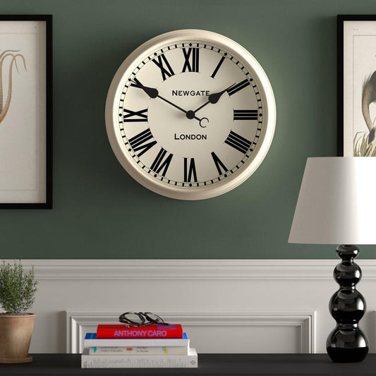 Vanilla cream wall clock with black Roman numerals and ornate Newgate hands