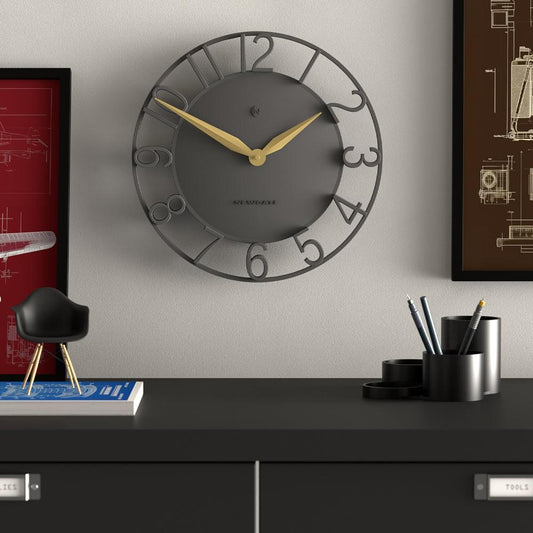 Grey round wall clock with gold hands and dark dial, styled number markers on outer frame