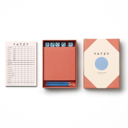 Yatzy game set with score card, dice tray, and square box with blue circle logo