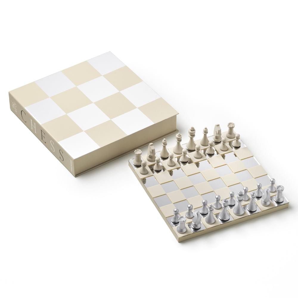 Open chess mirror case with checkered board and chess pieces arranged