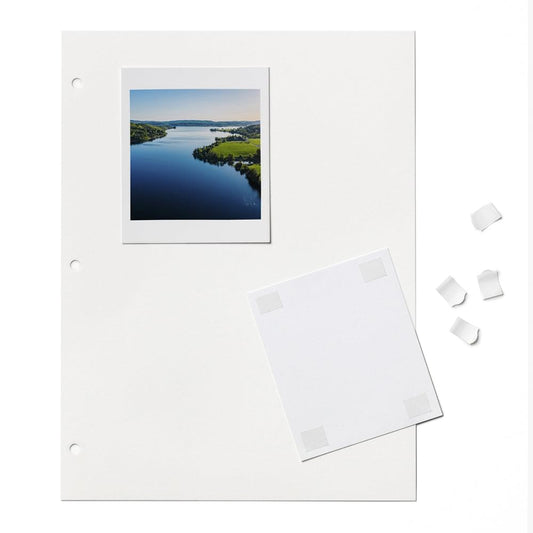 White photo album pages with landscape photo and flat self-adhesive corners