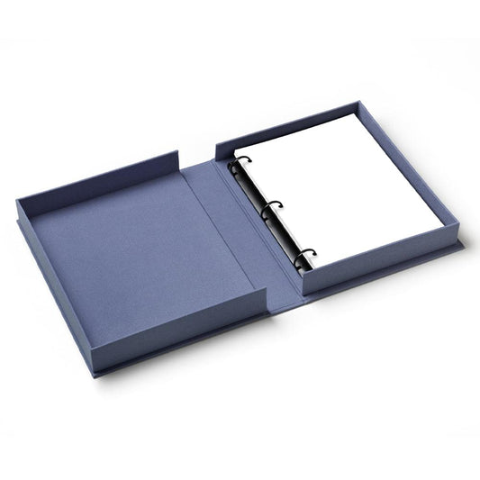 Blue photo album open flat with ring binder and blank white pages