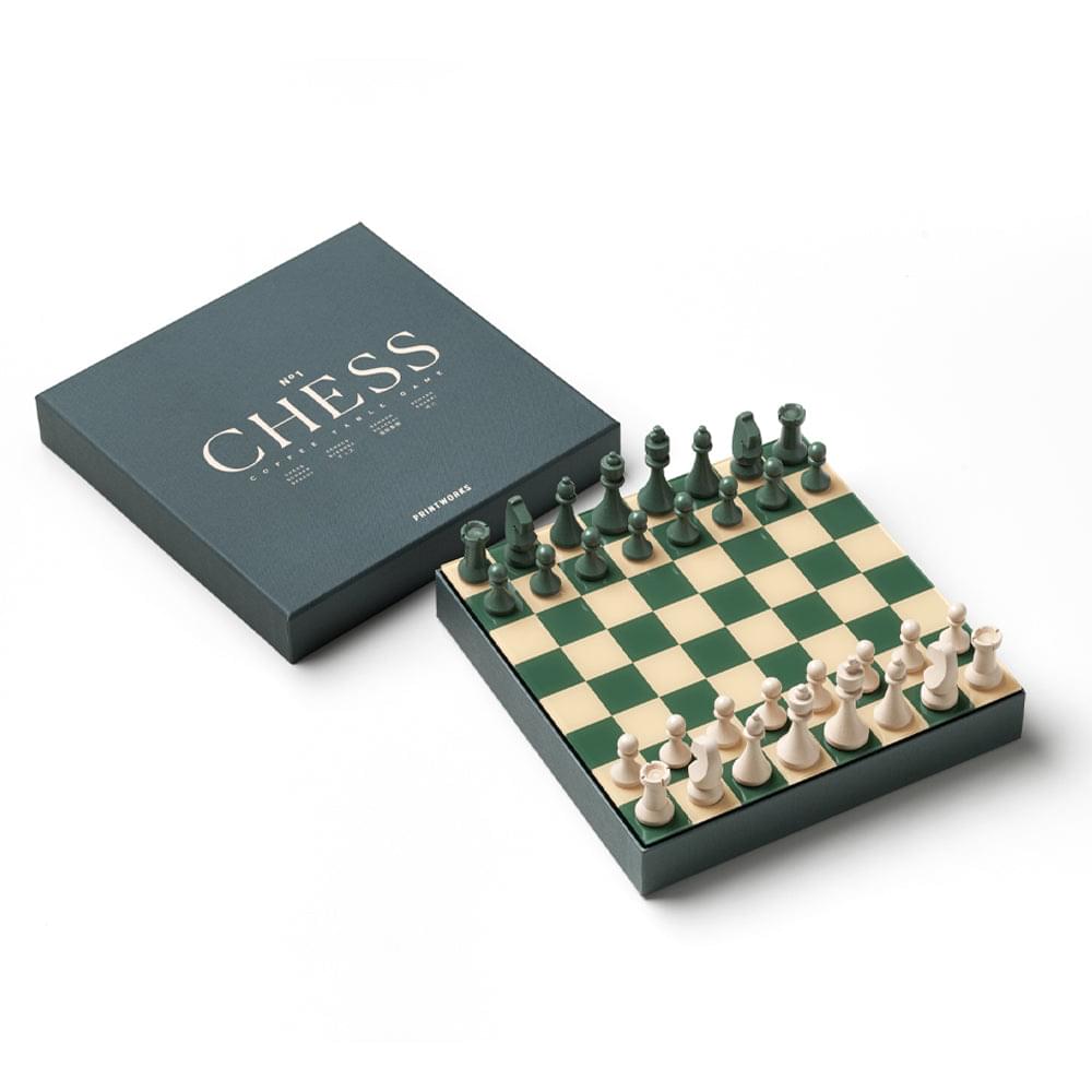 Dark green chess set box with CHESS title; board with green and white pieces
