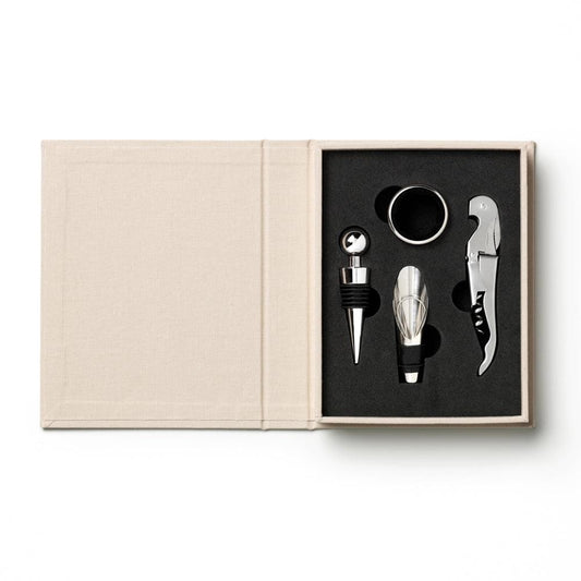 Beige open wine tools box with black insert holding four metal wine accessories