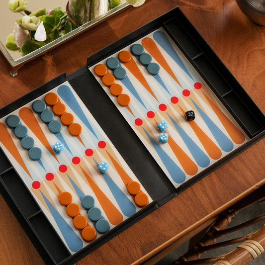 Backgammon board with orange and teal checkers and dice in black tray