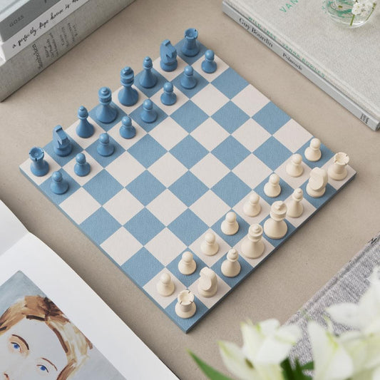 Chess set board with blue and cream pieces on blue-and-cream diamond squares