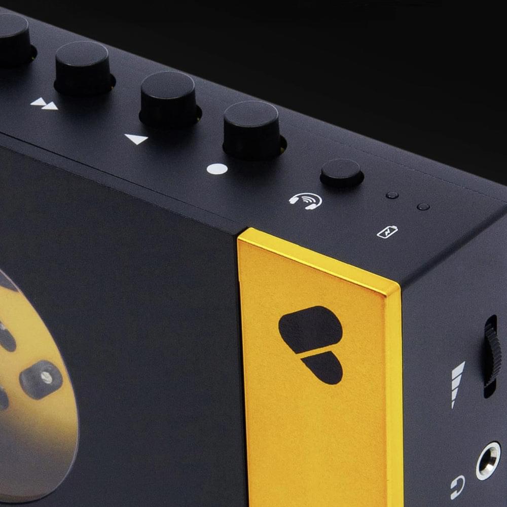 Portable cassette player and recorder, black with yellow side panel and control buttons