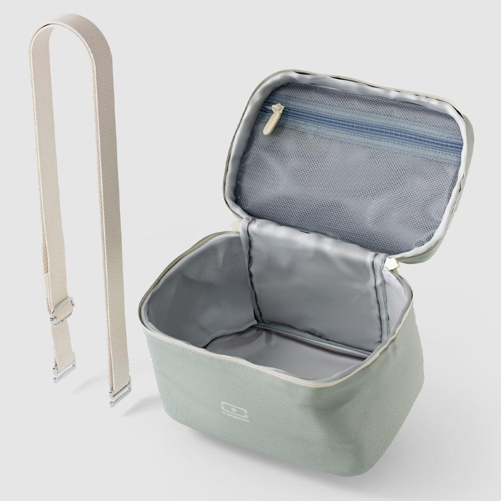 Light green cooler lunch bag opened to show silver insulated interior lining