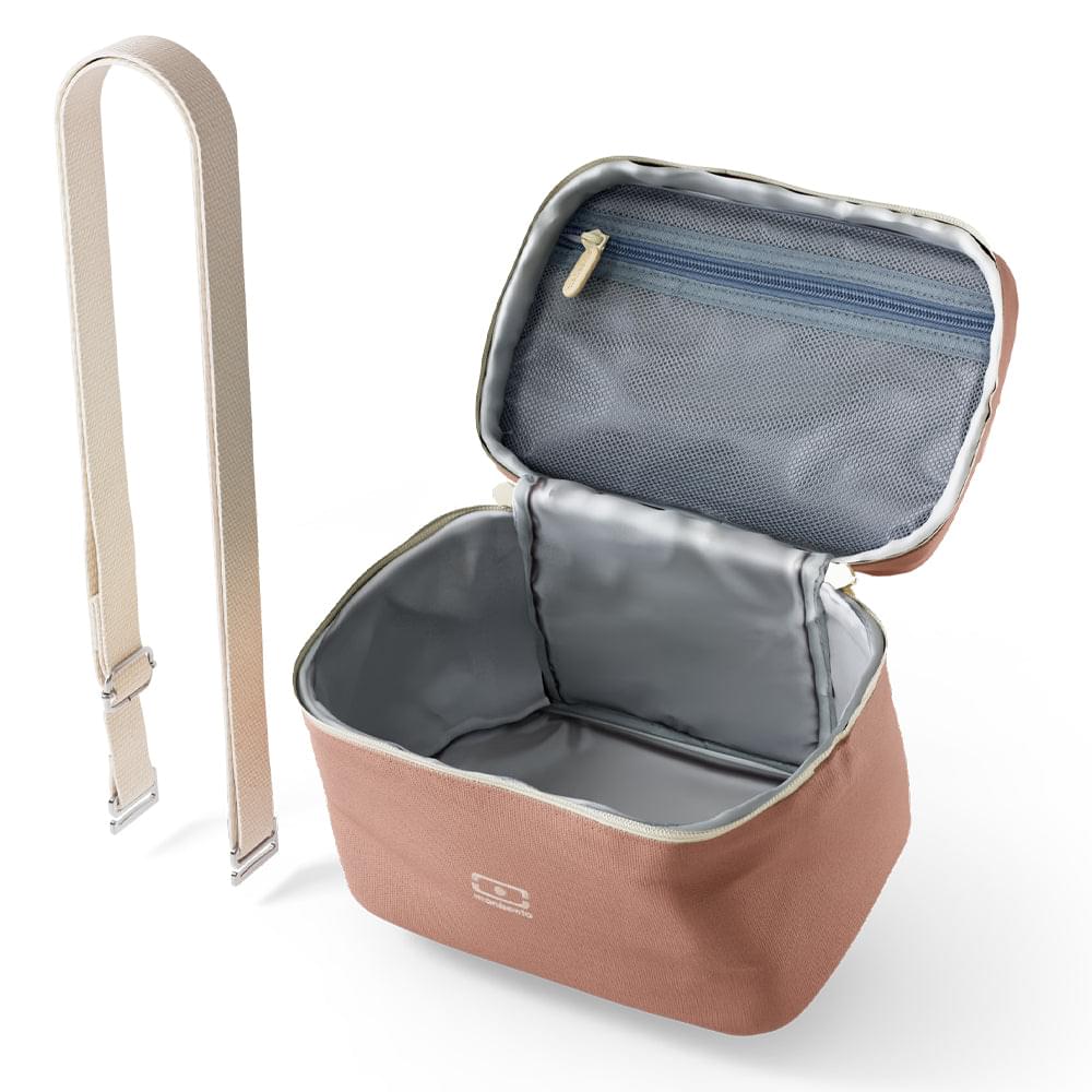 Insulated lunch cooler bag opened, pink exterior with gray lining and Monbento logo.