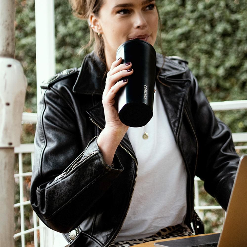 Matte black 750ml cold cup with straw and Corkcicle branding.