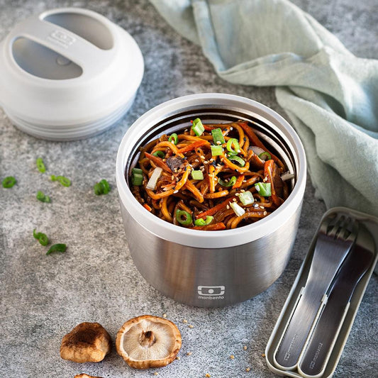 Monbento insulated bento box, open with noodles and vegetables inside