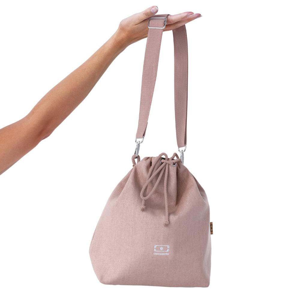 Blush pink lunch bag with drawstring closure and adjustable shoulder straps