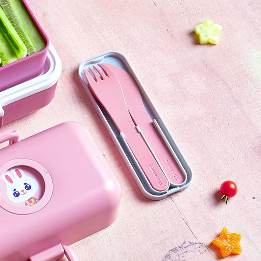 Pink blush plastic cutlery set with fork, knife and spoon in open gray case