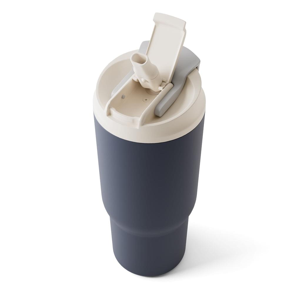 Dark blue travel mug with white lid removed, showing drinking mechanism