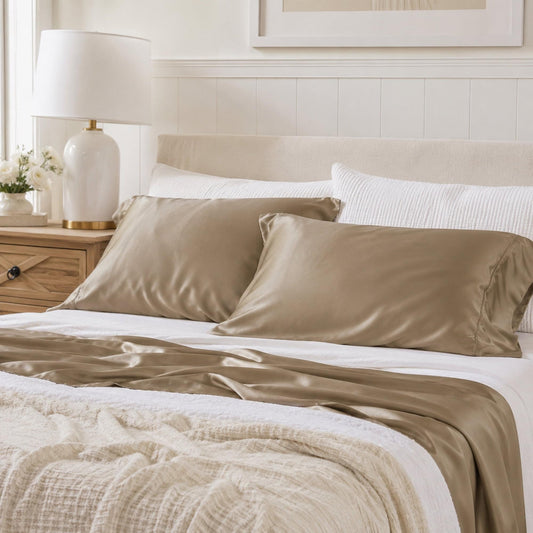 Latte-beige standard bamboo pillowcases on bed, smooth satin-like texture